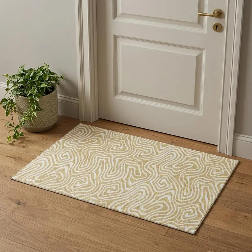 Gold And Ivory Abstract Washable Area Rug With UV Protection Photo 1