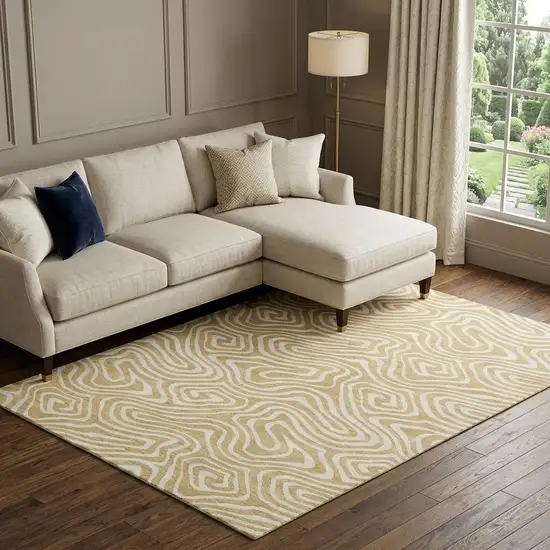Gold And Ivory Abstract Washable Area Rug With UV Protection Photo 1
