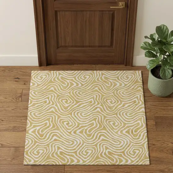 Gold And Ivory Abstract Washable Area Rug With UV Protection Photo 1