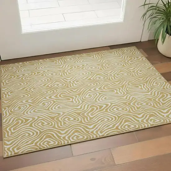 Gold And Ivory Abstract Washable Area Rug With UV Protection Photo 2