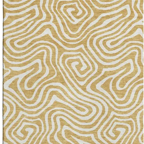 Gold And Ivory Abstract Washable Area Rug With UV Protection Photo 3