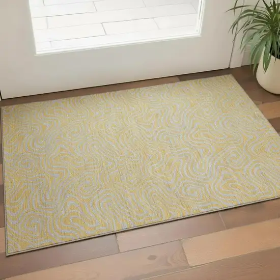 Gold And Ivory Abstract Washable Area Rug With UV Protection Photo 2