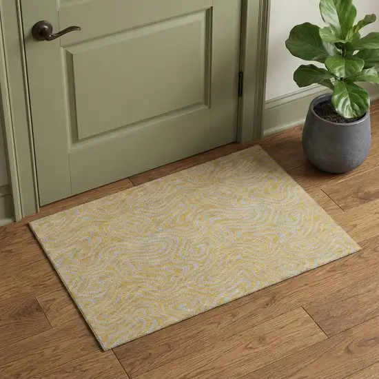 Gold And Ivory Abstract Washable Area Rug With UV Protection Photo 1