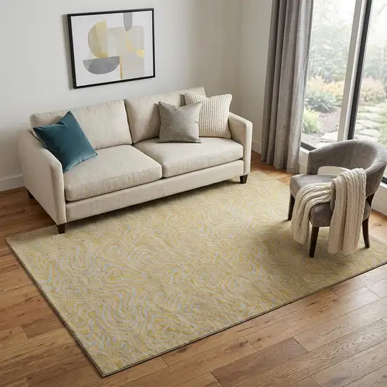 Gold And Ivory Abstract Washable Area Rug With UV Protection Photo 1