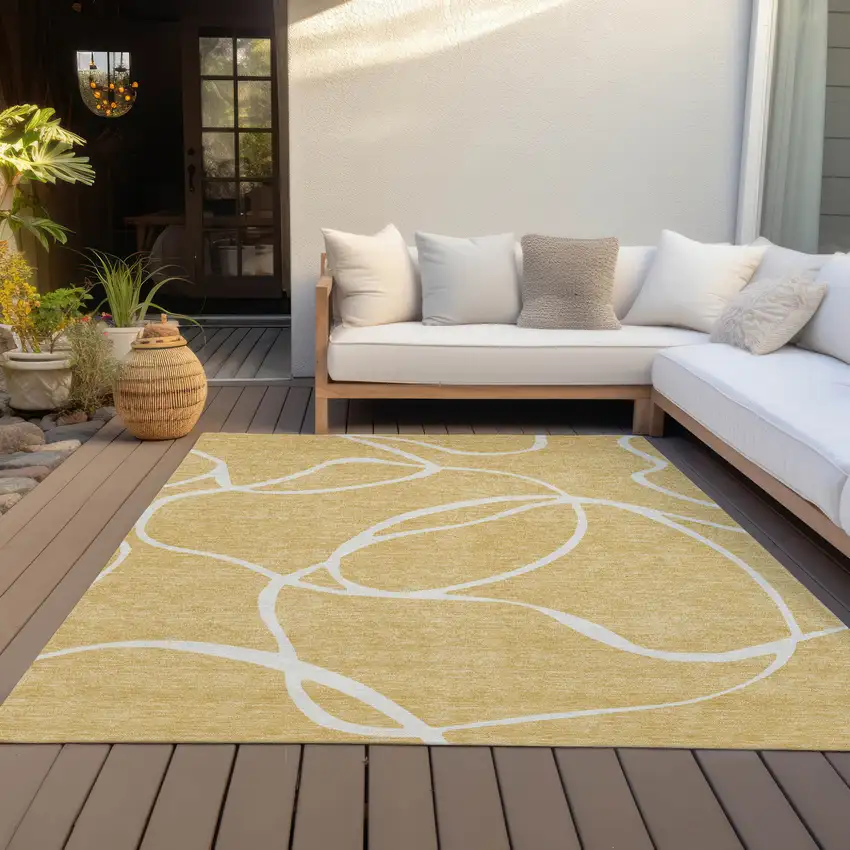 Gold And Ivory Abstract Washable Indoor Outdoor Area Rug Photo 8