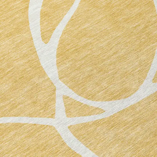 Gold And Ivory Abstract Washable Indoor Outdoor Area Rug Photo 6