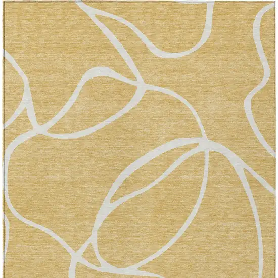 Gold And Ivory Abstract Washable Indoor Outdoor Area Rug Photo 7