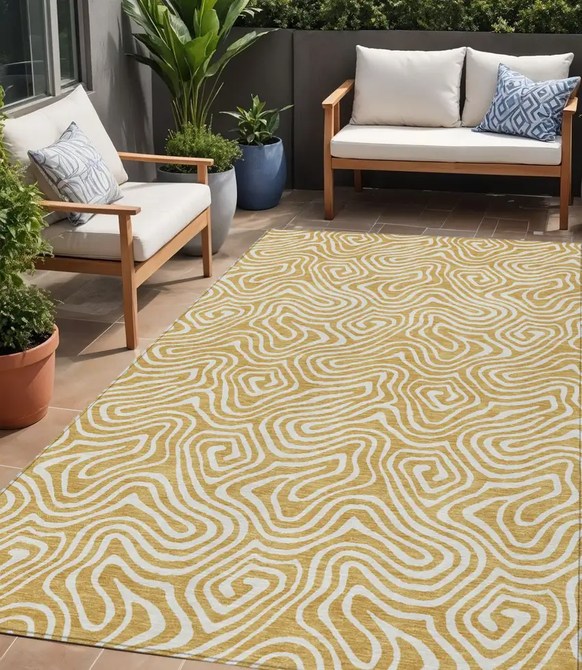 Gold And Ivory Abstract Washable Indoor Outdoor Area Rug Photo 1