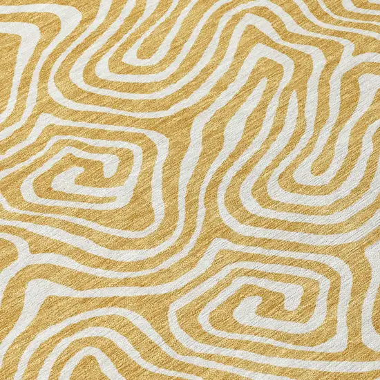 Gold And Ivory Abstract Washable Indoor Outdoor Area Rug Photo 6
