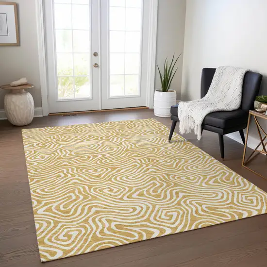 Gold And Ivory Abstract Washable Indoor Outdoor Area Rug Photo 9
