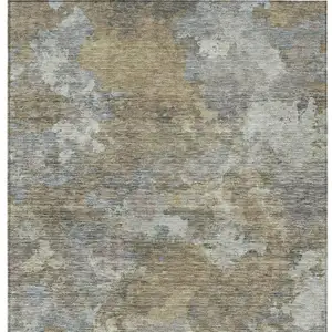 Photo of Gold And Ivory Abstract Washable Indoor Outdoor Area Rug