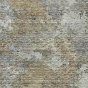 Photo of Gold And Ivory Abstract Washable Indoor Outdoor Area Rug