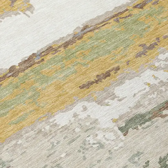 Gold And Ivory Abstract Washable Indoor Outdoor Area Rug Photo 5