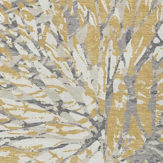 Gold And Ivory Abstract Washable Indoor Outdoor Area Rug Photo 4