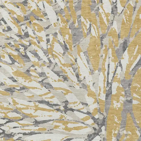 Gold And Ivory Abstract Washable Indoor Outdoor Area Rug Photo 5