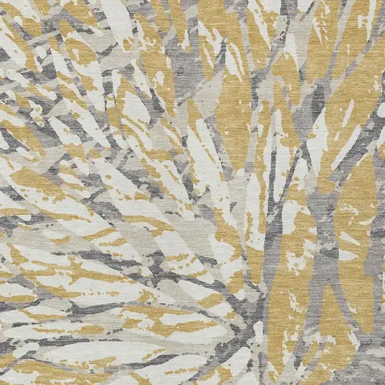 Gold And Ivory Abstract Washable Indoor Outdoor Area Rug Photo 3