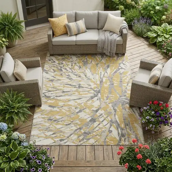 Gold And Ivory Abstract Washable Indoor Outdoor Area Rug Photo 1
