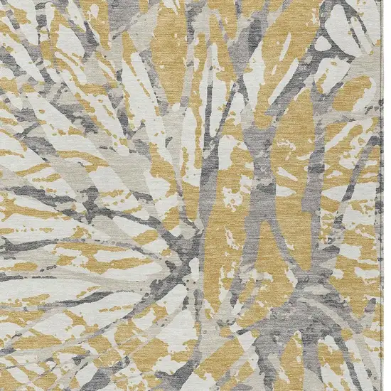 Gold And Ivory Abstract Washable Indoor Outdoor Area Rug Photo 5