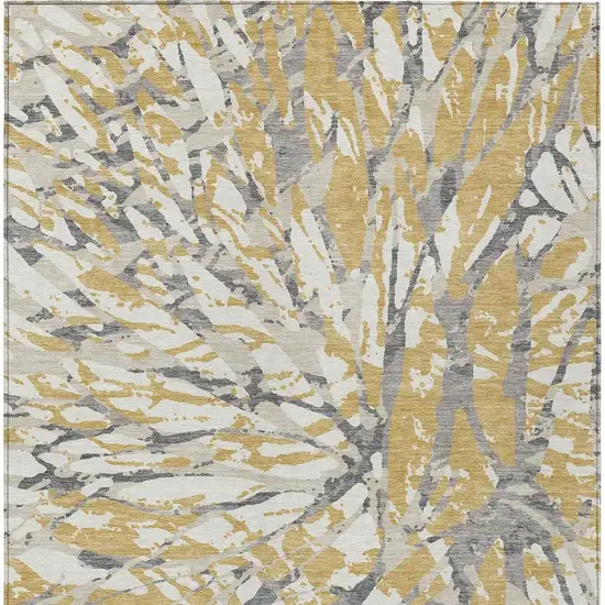 Gold And Ivory Abstract Washable Indoor Outdoor Area Rug Photo 6