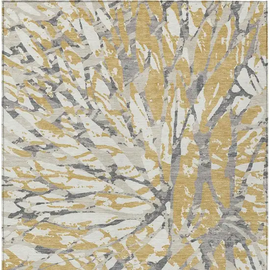 Gold And Ivory Abstract Washable Indoor Outdoor Area Rug Photo 4