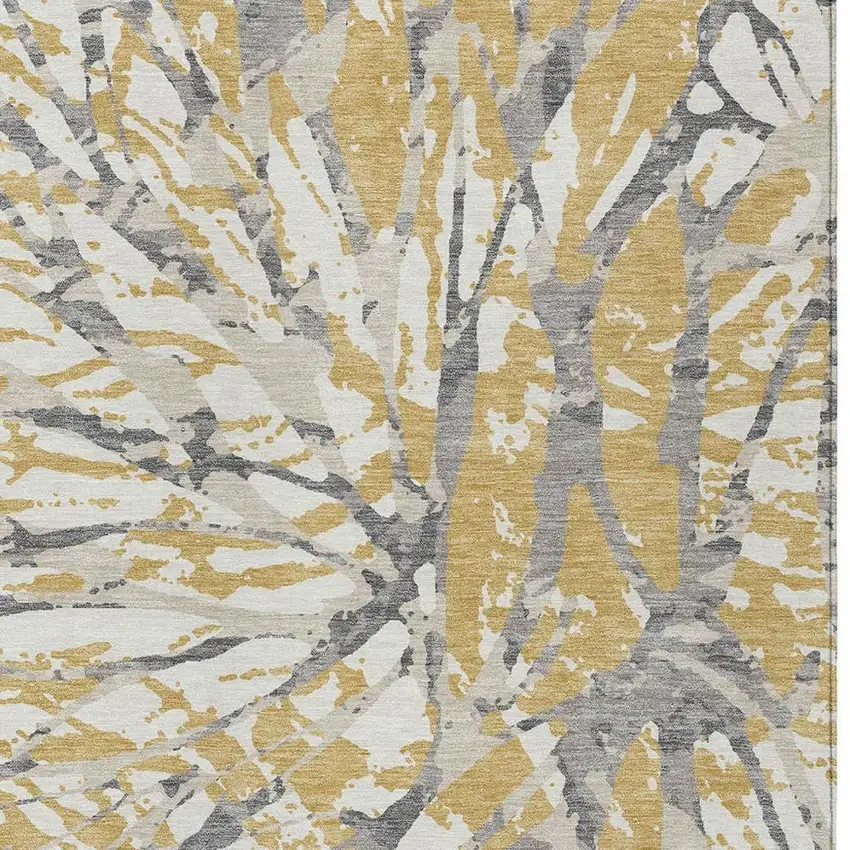Gold And Ivory Abstract Washable Indoor Outdoor Area Rug Photo 3