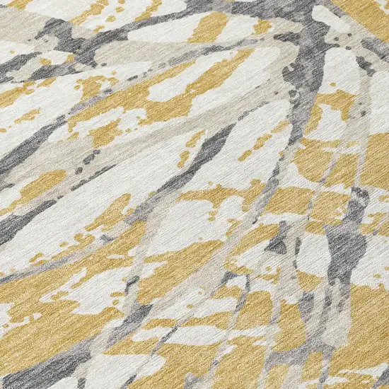Gold And Ivory Abstract Washable Indoor Outdoor Area Rug Photo 8