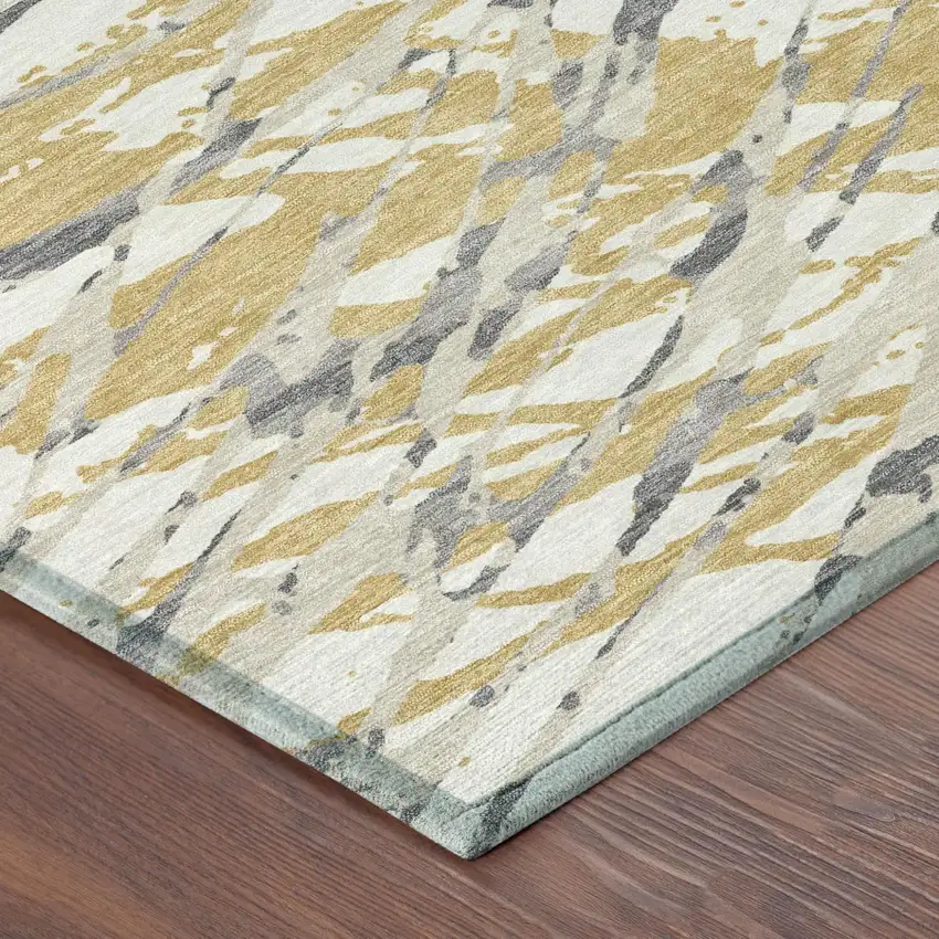Gold And Ivory Abstract Washable Indoor Outdoor Area Rug Photo 7