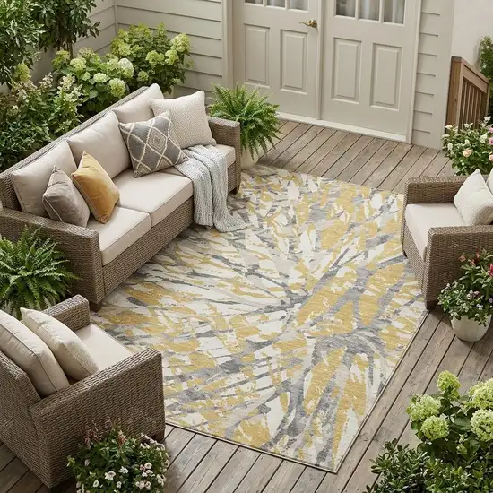 Gold And Ivory Abstract Washable Indoor Outdoor Area Rug Photo 1