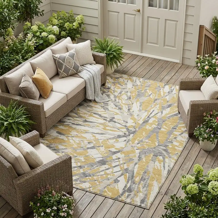 Gold And Ivory Abstract Washable Indoor Outdoor Area Rug Photo 1