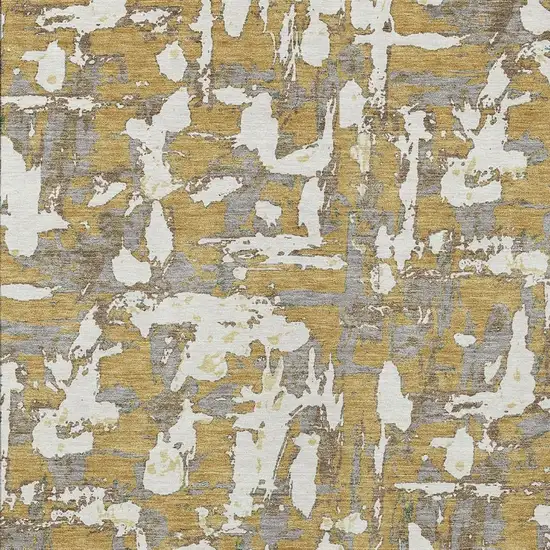 Gold And Ivory Abstract Washable Indoor Outdoor Area Rug Photo 5
