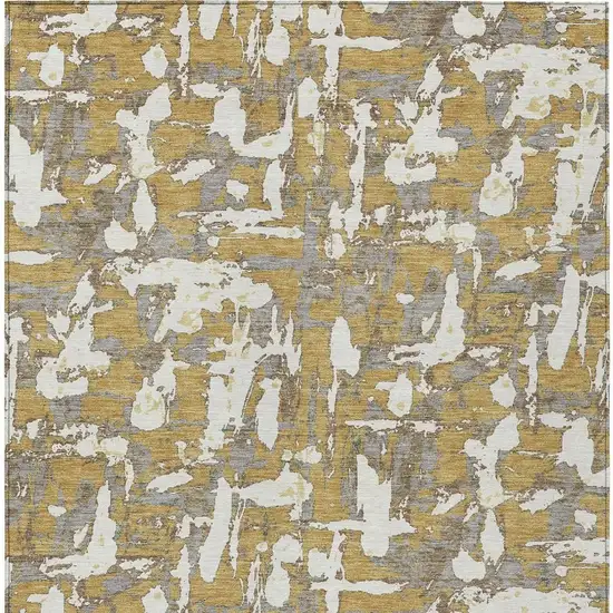 Gold And Ivory Abstract Washable Indoor Outdoor Area Rug Photo 6