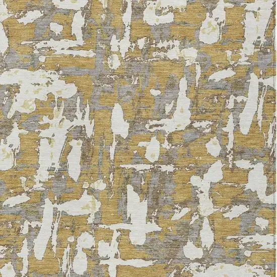Gold And Ivory Abstract Washable Indoor Outdoor Area Rug Photo 3