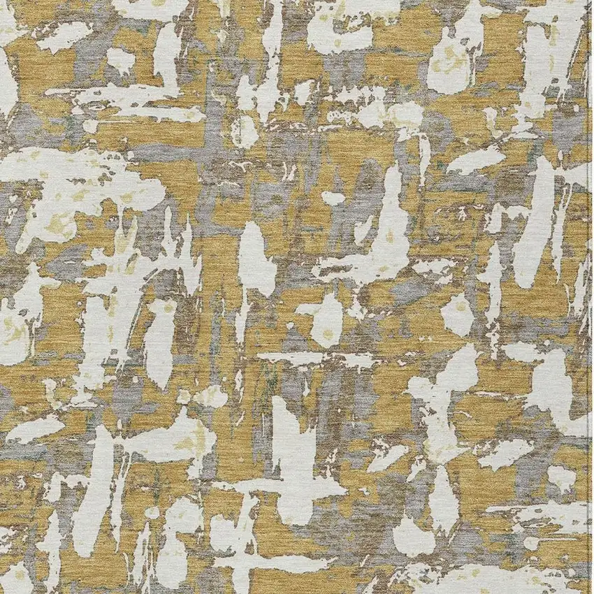 Gold And Ivory Abstract Washable Indoor Outdoor Area Rug Photo 3