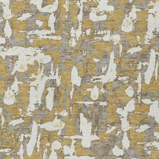 Gold And Ivory Abstract Washable Indoor Outdoor Area Rug Photo 5