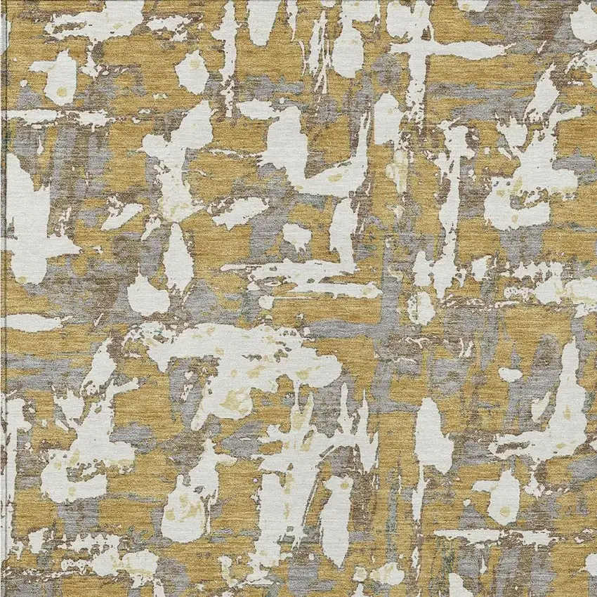 Gold And Ivory Abstract Washable Indoor Outdoor Area Rug Photo 3