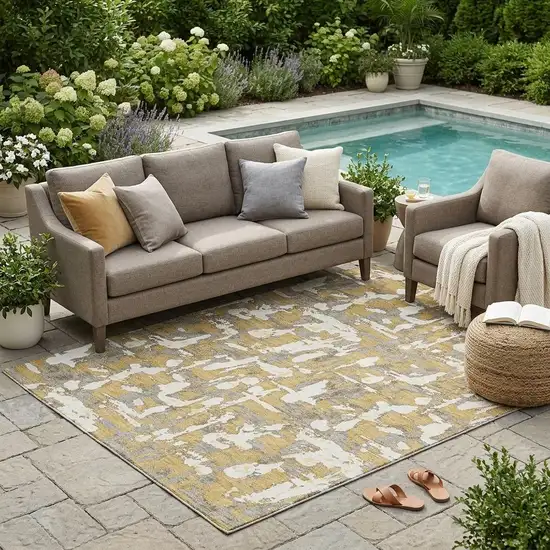 Gold And Ivory Abstract Washable Indoor Outdoor Area Rug Photo 1
