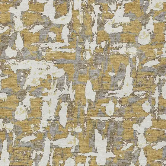 Gold And Ivory Abstract Washable Indoor Outdoor Area Rug Photo 3