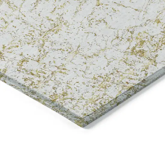 Gold And Ivory Abstract Washable Indoor Outdoor Area Rug Photo 4