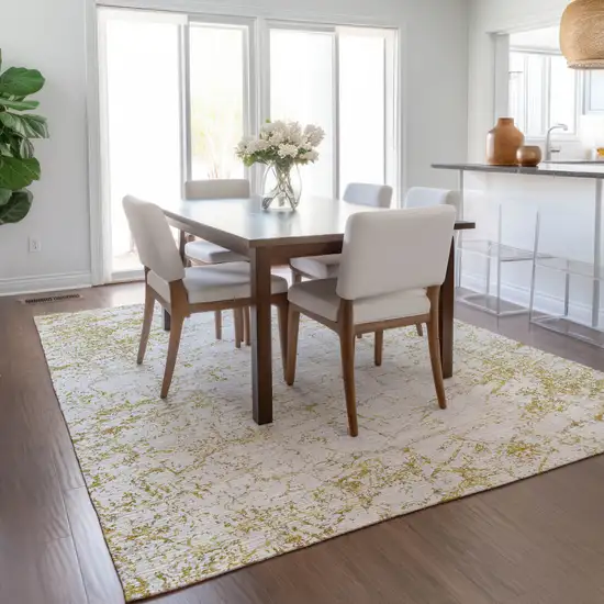 Gold And Ivory Abstract Washable Indoor Outdoor Area Rug Photo 8