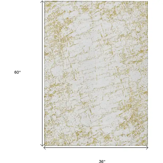 Gold And Ivory Abstract Washable Indoor Outdoor Area Rug Photo 3