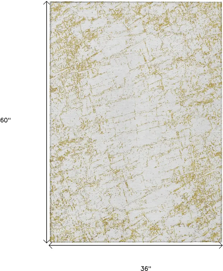 Gold And Ivory Abstract Washable Indoor Outdoor Area Rug Photo 3