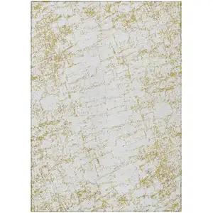 Photo of Gold And Ivory Abstract Washable Indoor Outdoor Area Rug