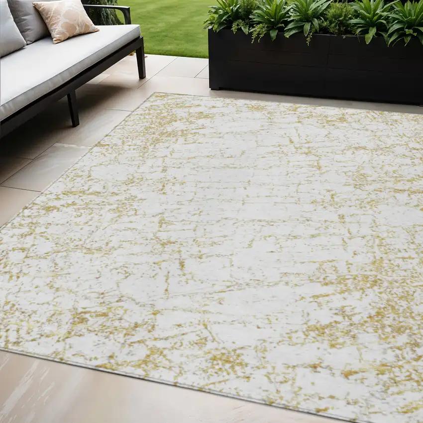 Gold And Ivory Abstract Washable Indoor Outdoor Area Rug Photo 1