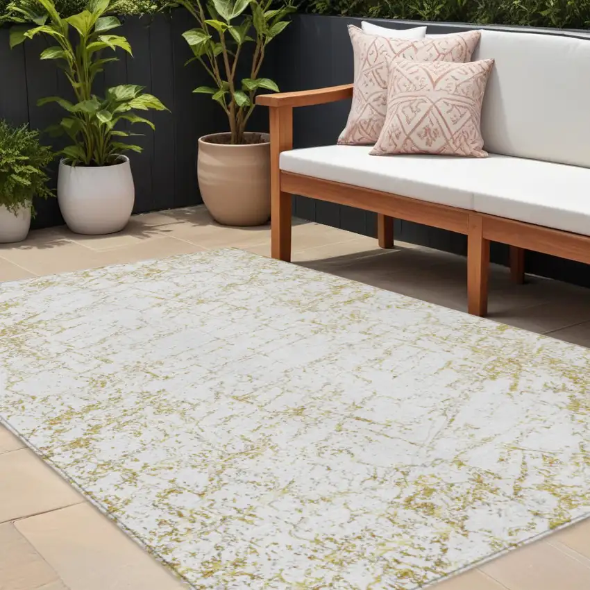 Gold And Ivory Abstract Washable Indoor Outdoor Area Rug Photo 1