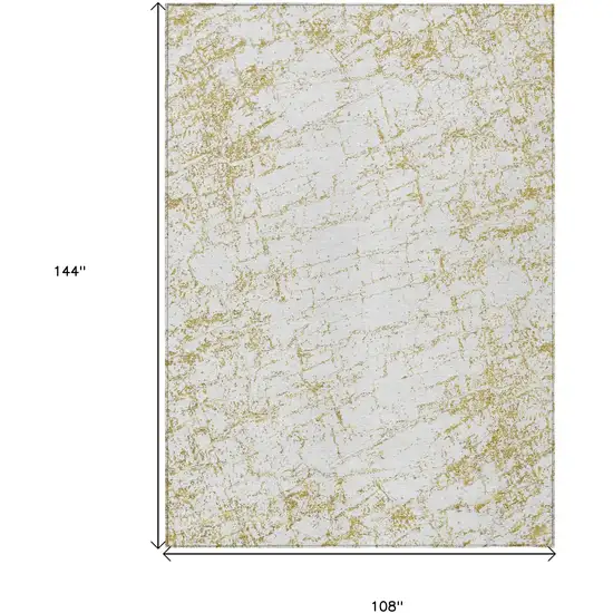 Gold And Ivory Abstract Washable Indoor Outdoor Area Rug Photo 3