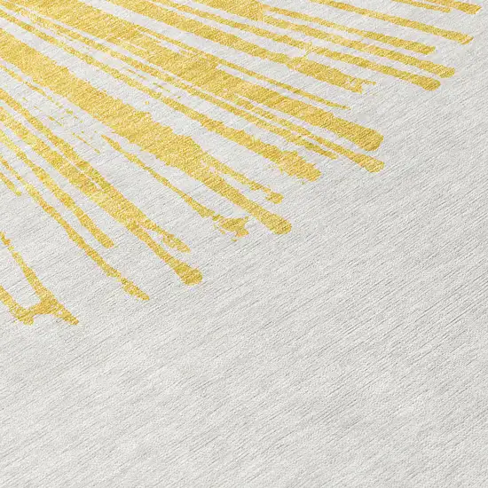 Gold And Ivory Abstract Washable Indoor Outdoor Area Rug Photo 4