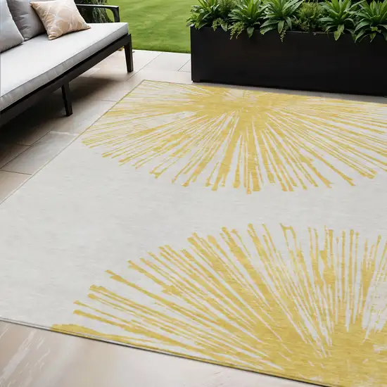 Gold And Ivory Abstract Washable Indoor Outdoor Area Rug Photo 1