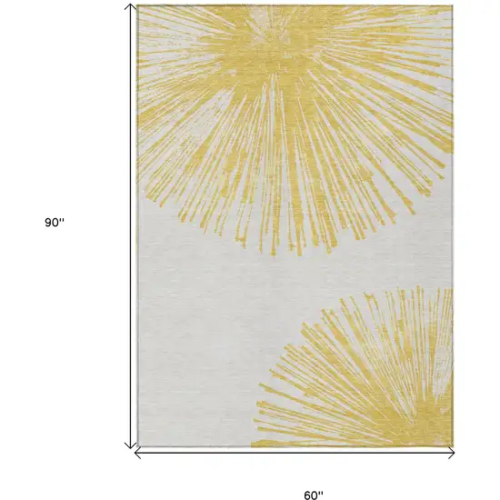 Gold And Ivory Abstract Washable Indoor Outdoor Area Rug Photo 9