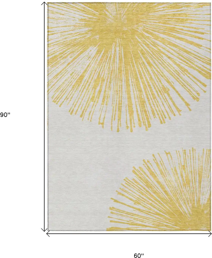 Gold And Ivory Abstract Washable Indoor Outdoor Area Rug Photo 9