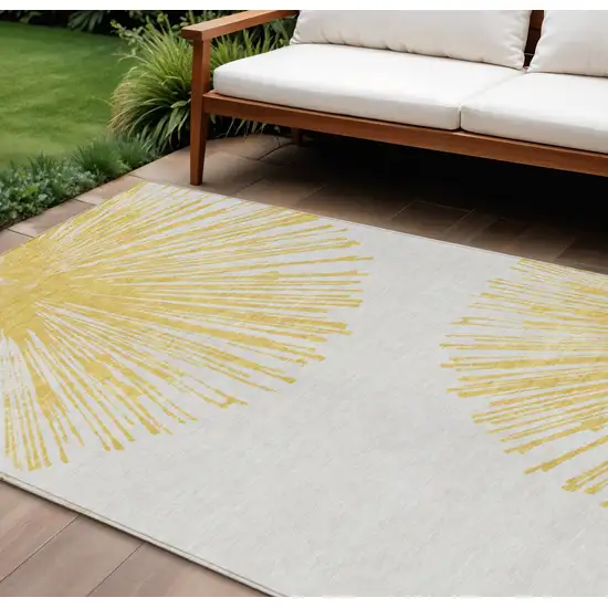 Gold And Ivory Abstract Washable Indoor Outdoor Area Rug Photo 1